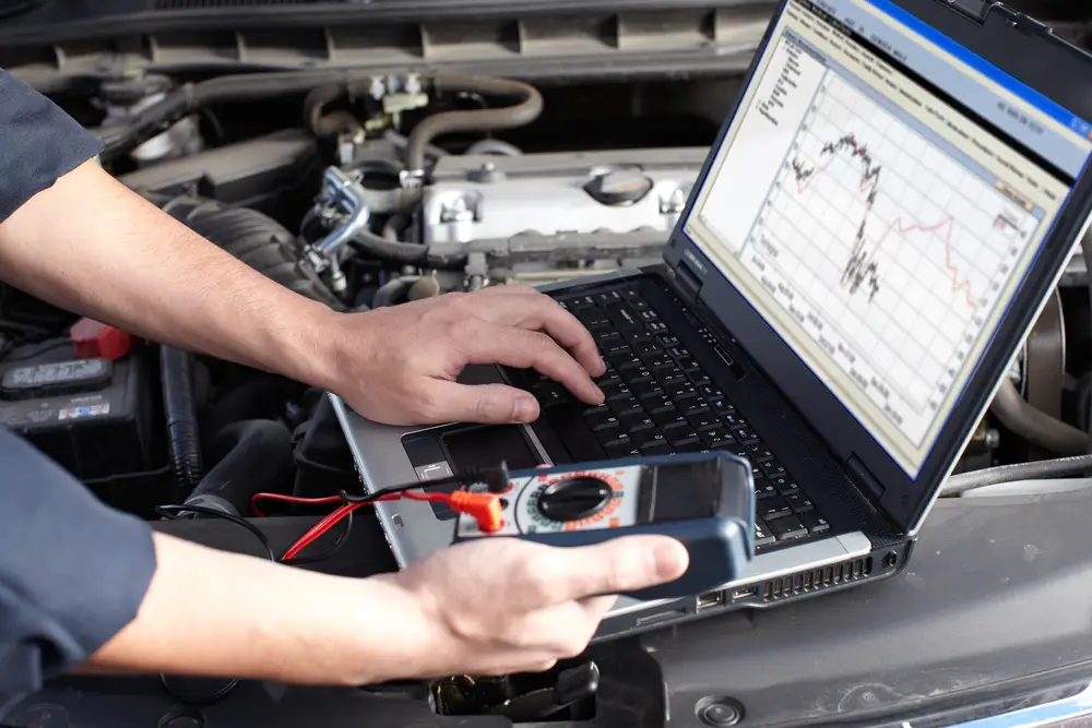 mechanic car and truck diagnosing issue